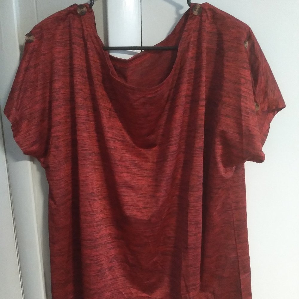 Women's short sleeve black and red top with button accents on the sleeves.